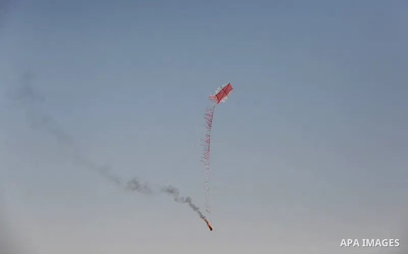 A kite laden with a molotov cocktail being flown by Palestinian protesters over the border with Israel before cutting the string across the fence, durin in a protest marking al-Quds Day, (Jerusalem Day), at the Israel-Ga...