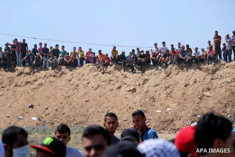 Palestinian protesters gather during clashes with Israeli troops in a protest marking al-Quds Day, (Jerusalem Day), at the Israel-Gaza border in al-Bureij in the center of Gaza Strip on June 8, 2018. Photo by Mahmoud Kha...
