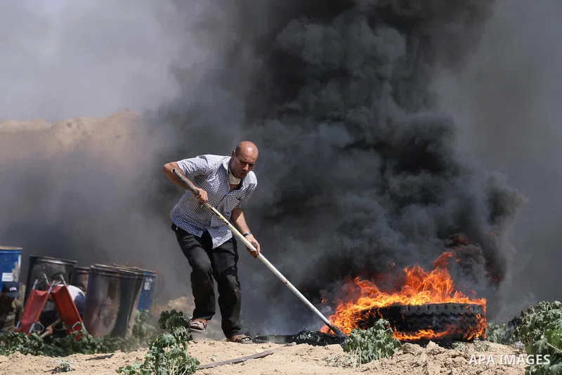 Palestinian protesters gather during clashes with Israeli troops in a protest marking al-Quds Day, (Jerusalem Day), at the Israel-Gaza border in al-Bureij in the center of Gaza Strip on June 8, 2018. Photo by Mahmoud Kha...