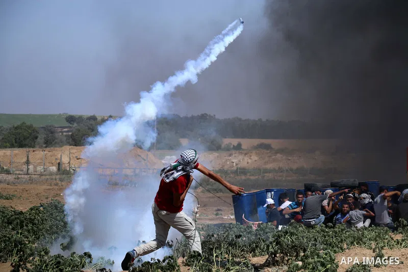 Palestinian protesters gather during clashes with Israeli troops in a protest marking al-Quds Day, (Jerusalem Day), at the Israel-Gaza border in al-Bureij in the center of Gaza Strip on June 8, 2018. Photo by Mahmoud Kha...