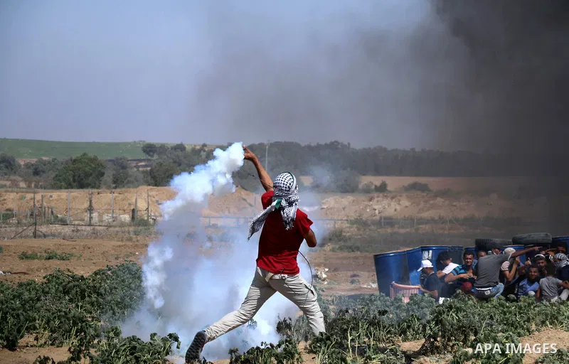 Palestinian protesters gather during clashes with Israeli troops in a protest marking al-Quds Day, (Jerusalem Day), at the Israel-Gaza border in al-Bureij in the center of Gaza Strip on June 8, 2018. Photo by Mahmoud Kha...