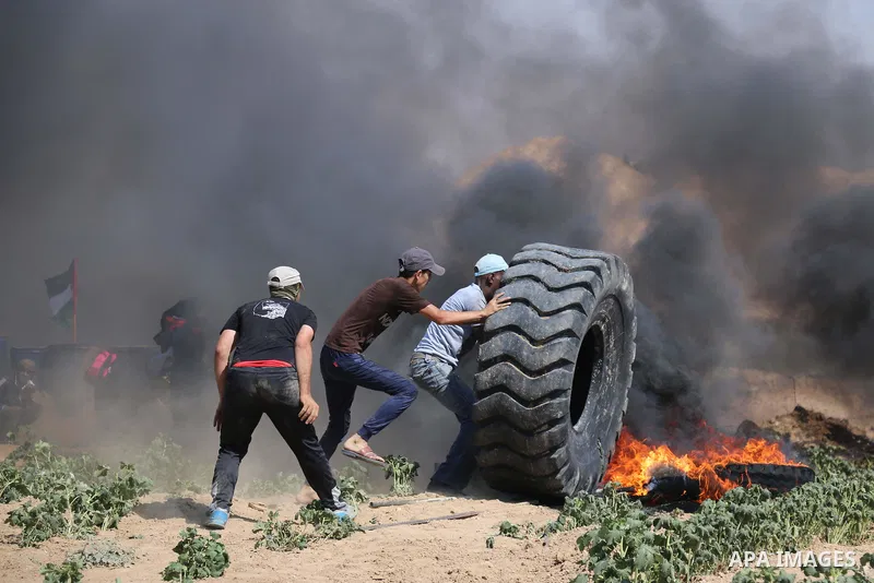 Palestinian protesters gather during clashes with Israeli troops in a protest marking al-Quds Day, (Jerusalem Day), at the Israel-Gaza border in al-Bureij in the center of Gaza Strip on June 8, 2018. Photo by Mahmoud Kha...
