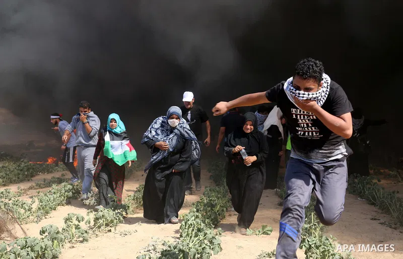 Palestinian protesters gather during clashes with Israeli troops in a protest marking al-Quds Day, (Jerusalem Day), at the Israel-Gaza border in al-Bureij in the center of Gaza Strip on June 8, 2018. Photo by Mahmoud Kha...