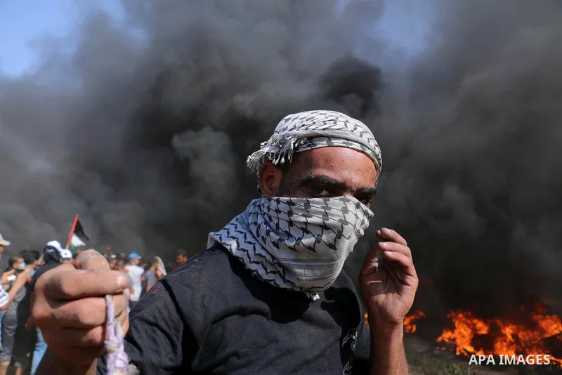 Palestinian protesters gather during clashes with Israeli troops in a protest marking al-Quds Day, (Jerusalem Day), at the Israel-Gaza border in al-Bureij in the center of Gaza Strip on June 8, 2018. Photo by Mahmoud Kha...