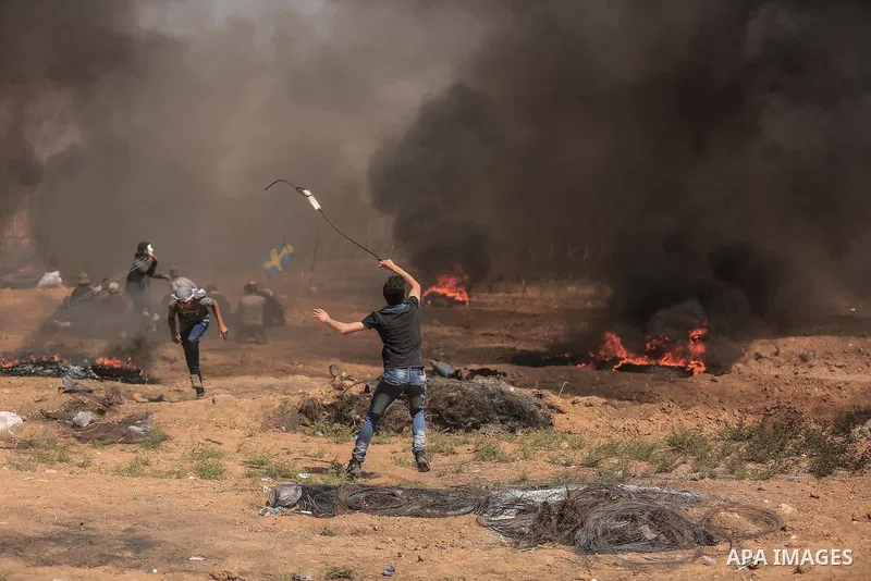 Palestinian protesters gather during clashes with Israeli troops in a protest marking al-Quds Day, (Jerusalem Day), at the Israel-Gaza border in east of Gaza city, on June 8, 2018. Photo by Dawoud Abo Alkas