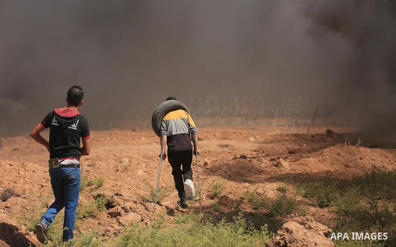 Palestinian protesters gather during clashes with Israeli troops in a protest marking al-Quds Day, (Jerusalem Day), at the Israel-Gaza border in east of Gaza city, on June 8, 2018. Photo by Dawoud Abo Alkas