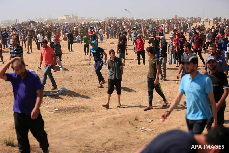 Palestinian protesters gather during clashes with Israeli troops in a protest marking al-Quds Day, (Jerusalem Day), at the Israel-Gaza border in east of Gaza city, on June 8, 2018. Photo by Dawoud Abo Alkas