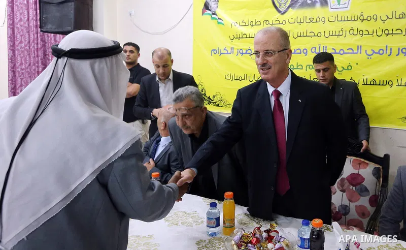 Palestinian Prime Minister Rami Hamdallah honors players of social youth center team, in the West Bank city of Tulkarem on June 8, 2018. Photo by Prime Minister Office