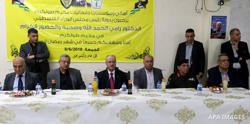 Palestinian Prime Minister Rami Hamdallah honors players of social youth center team, in the West Bank city of Tulkarem on June 8, 2018. Photo by Prime Minister Office