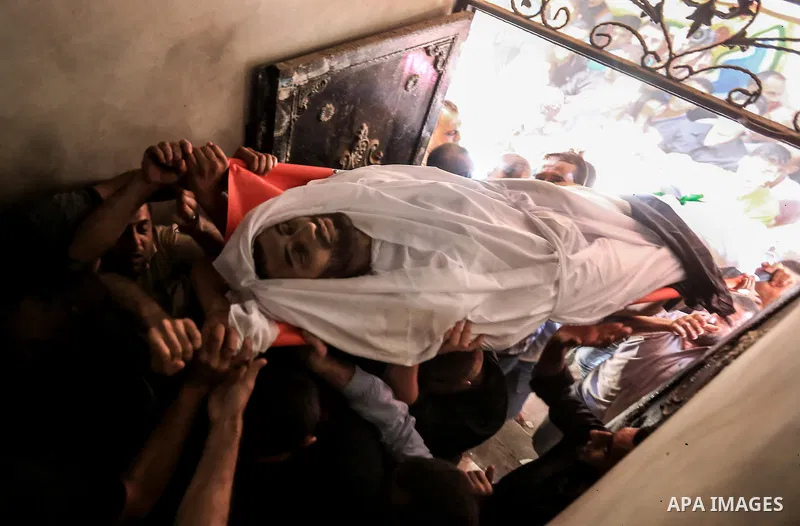Palestinian relatives carry the body of Yussef al-Faseeh, 29, who was shot dead by Israeli troops during clashes at Israel-Gaza border, during his funeral in Gaza city on on 9, 2018. Four Palestinians were killed by Isra...