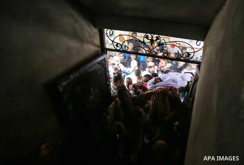 Palestinian relatives carry the body of Yussef al-Faseeh, 29, who was shot dead by Israeli troops during clashes at Israel-Gaza border, during his funeral in Gaza city on on 9, 2018. Four Palestinians were killed by Isra...