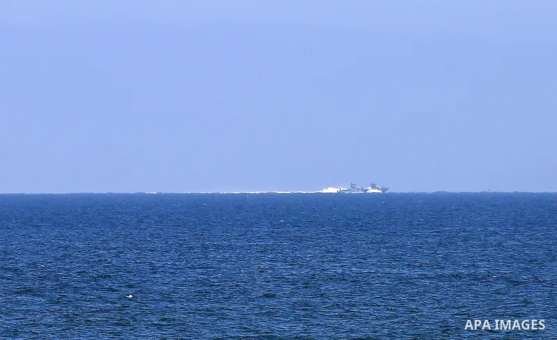 A picture taken on June 9, 2018 shows Israeli naval ships patrol off the coast of Gaza City. Photo by Dawoud Abo Alkas