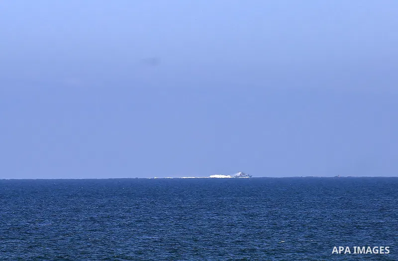 A picture taken on June 9, 2018 shows Israeli naval ships patrol off the coast of Gaza City. Photo by Dawoud Abo Alkas