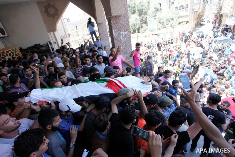 Palestinian relatives carry the body of Yussef al-Faseeh, 29, who was shot dead by Israeli troops during clashes at Israel-Gaza border, during his funeral in Gaza city on on 9, 2018. Four Palestinians were killed by Isra...