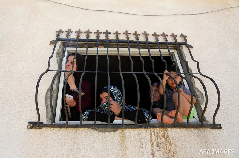 Palestinian relatives mourn during the funeral of Ziad al-Barim, 25, who was shot dead by Israeli troops during clashes at Israel-Gaza border, in Khan Younis in the southern Gaza strip on June 9, 2018. Four Palestinians...