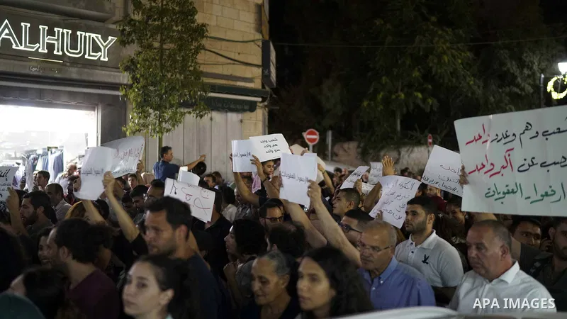 Palestinians take part in a protest demanding to lift the sanctions on Gaza Strip, in the West Bank city of Ramallah, on June 10, 2018. Photo by Eyad Jadallah