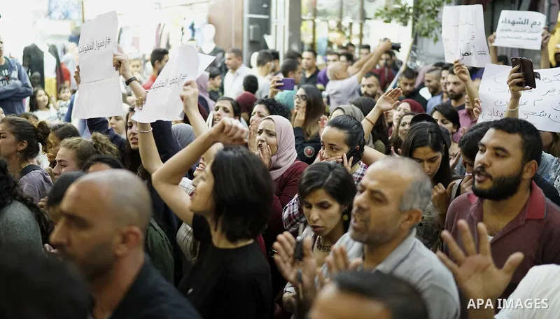 Palestinians take part in a protest demanding to lift the sanctions on Gaza Strip, in the West Bank city of Ramallah, on June 10, 2018. Photo by Eyad Jadallah