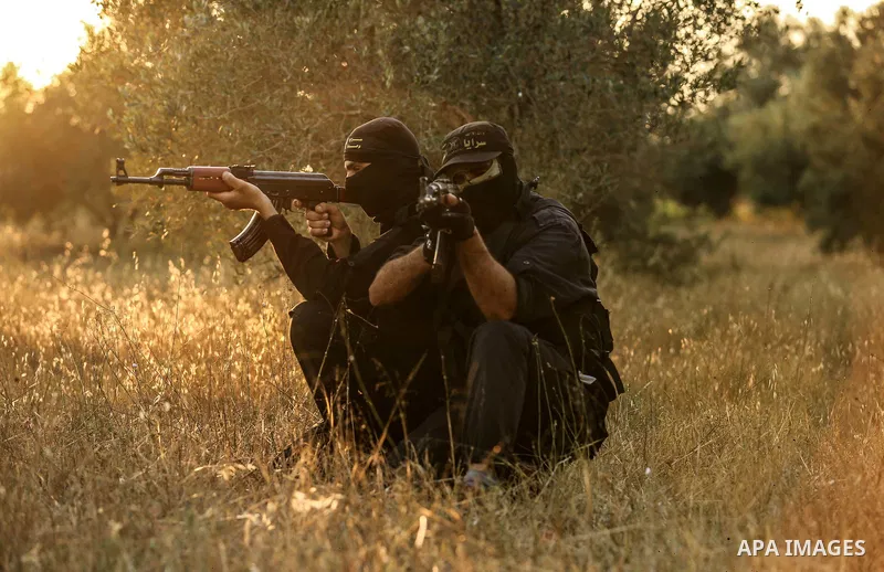 Palestinian militants from the Al-Quds Brigades, the armed wing of the Islamic Jihad movement guard the border in the east of Gaza city on the Muslim holy fasting month of Ramadan on June 13, 2018. Ramadan is sacred to M...