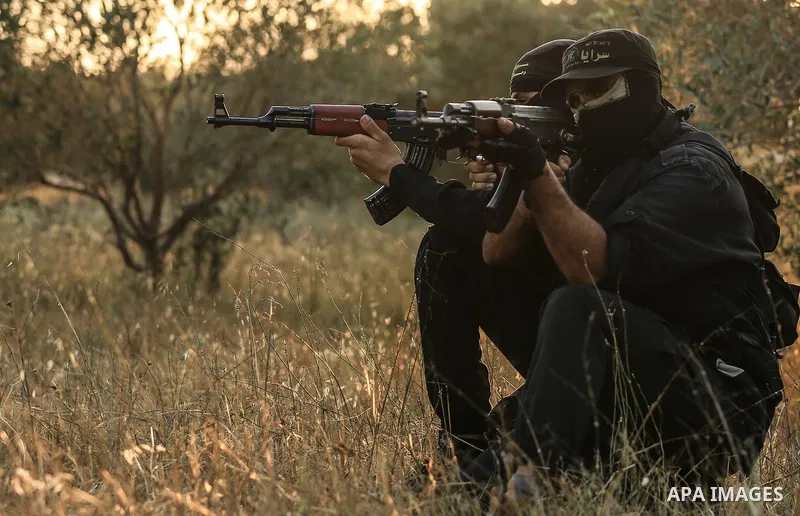 Palestinian militants from the Al-Quds Brigades, the armed wing of the Islamic Jihad movement guard the border in the east of Gaza city on the Muslim holy fasting month of Ramadan on June 13, 2018. Ramadan is sacred to M...