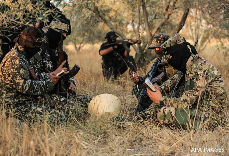 Palestinian militants from the Al-Quds Brigades, the armed wing of the Islamic Jihad movement guard the border in the east of Gaza city on the Muslim holy fasting month of Ramadan on June 13, 2018. Ramadan is sacred to M...