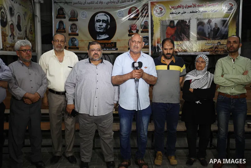 Palestinians take part in a protest to show solidarity with Palestinian prisoners held in Israeli jails, in front of Red cross office in Gaza city on June 14, 2018. Photo by Mahmoud Ajour