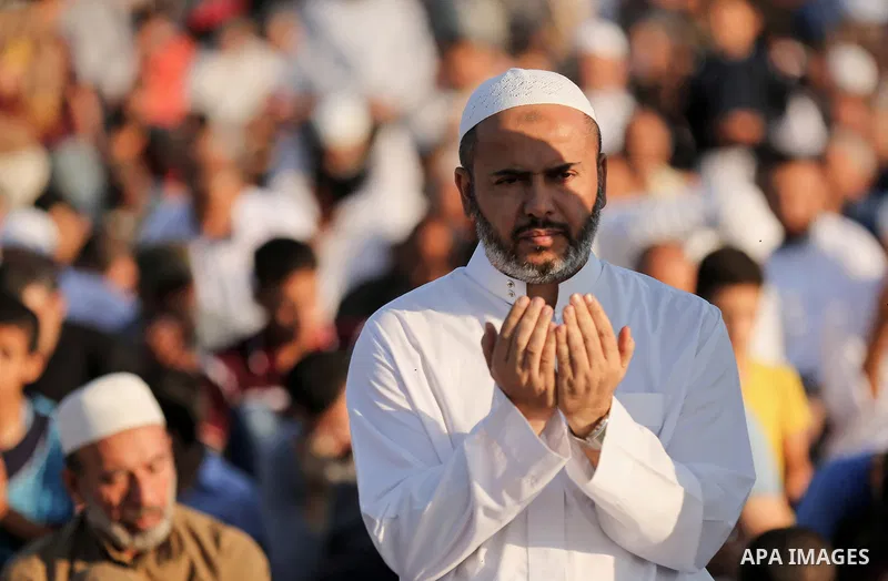 Palestinian Muslim worshipers perform Eid al-Fitr prayer at Israel-Gaza border in east of Gaza city on June 15, 2018. Eid al-Fitr marks the end of Muslim's holy fasting month of Ramadan when faithfuls abstain from eating...