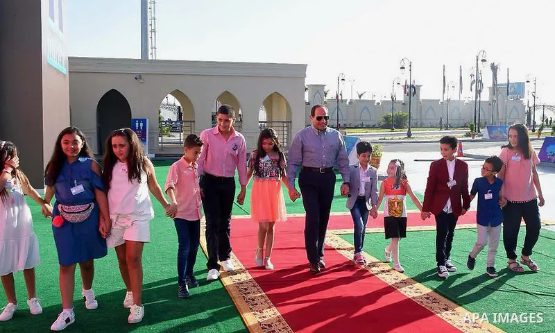 Egyptian President Abdel Fattah al-Sisi celebrates with the families of martyrs on the first day of Eid al-Fitr holiday which marks the end of the Muslim holy month of Ramadan, in Cairo, Egypt, on June 15, 2018. Eid al-F...