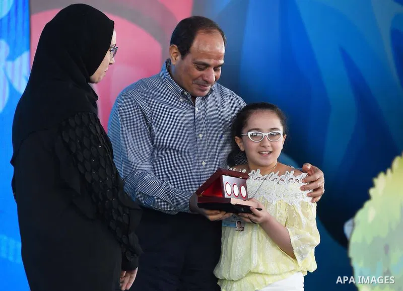 Egyptian President Abdel Fattah al-Sisi celebrates with the families of martyrs on the first day of Eid al-Fitr holiday which marks the end of the Muslim holy month of Ramadan, in Cairo, Egypt, on June 15, 2018. Eid al-F...