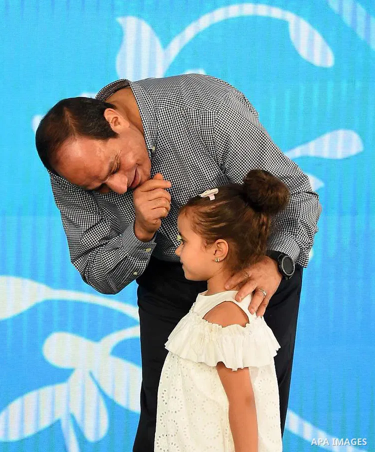 Egyptian President Abdel Fattah al-Sisi celebrates with the families of martyrs on the first day of Eid al-Fitr holiday which marks the end of the Muslim holy month of Ramadan, in Cairo, Egypt, on June 15, 2018. Eid al-F...