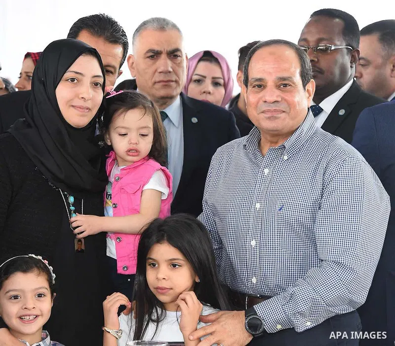 Egyptian President Abdel Fattah al-Sisi celebrates with the families of martyrs on the first day of Eid al-Fitr holiday which marks the end of the Muslim holy month of Ramadan, in Cairo, Egypt, on June 15, 2018. Eid al-F...