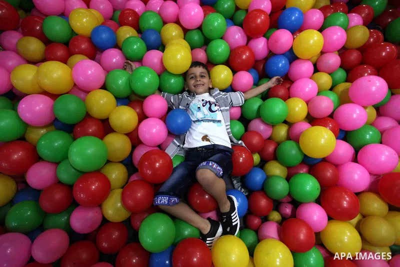 Palestinian children celebrate on the second day of Eid al-Fitr holiday which marks the end of the Muslim holy month of Ramadan in Gaza city June 16, 2018. Eid al-Fitr marks the end of Muslim's holy fasting month of Rama...