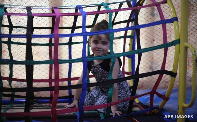 Palestinian children celebrate on the second day of Eid al-Fitr holiday which marks the end of the Muslim holy month of Ramadan in Gaza city June 16, 2018. Eid al-Fitr marks the end of Muslim's holy fasting month of Rama...