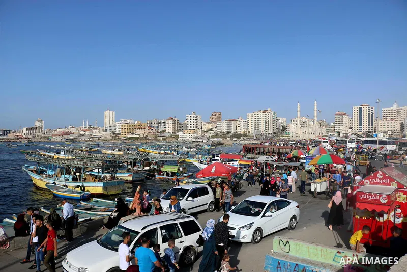 Palestinians enjoy their time off the coast of Gaza City on the third day of Eid al-Fitr holiday which marks the end of the Muslim holy month of Ramadan, on June 17, 2018. Photo by Mahmoud Khattab