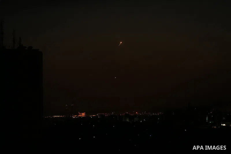 Missiles from the Iron Dome air defence system, designed to intercept and destroy incoming short-range rockets and artillery shells, from a position in the southern Israeli are seen from Gaza city on June 20, 2018. Photo...