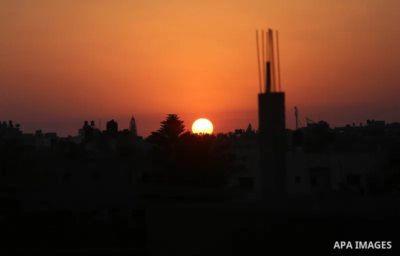 A general view shows the Khan Younis town in the southern Gaza Strip during a Sunrise on June 20, 2018. Photo by Ashraf Amra