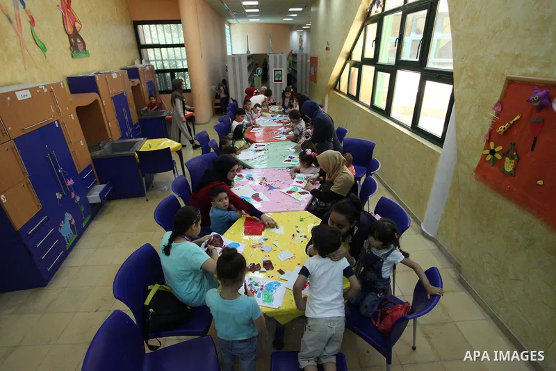 Palestinian children enjoy as part of the activities during a summer holiday, at Qattan Foundation in Gaza city, on June 21, 2018. Photo by Mahmoud Ajour