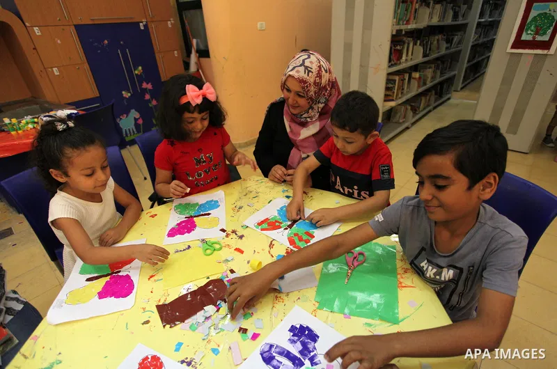 Palestinian children enjoy as part of the activities during a summer holiday, at Qattan Foundation in Gaza city, on June 21, 2018. Photo by Mahmoud Ajour