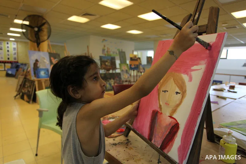 Palestinian children enjoy as part of the activities during a summer holiday, at Qattan Foundation in Gaza city, on June 21, 2018. Photo by Mahmoud Ajour