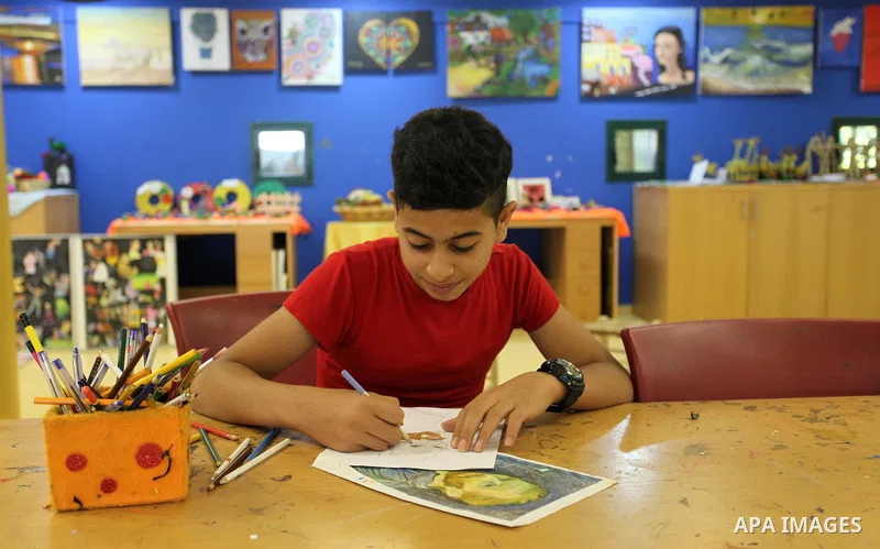 Palestinian children enjoy as part of the activities during a summer holiday, at Qattan Foundation in Gaza city, on June 21, 2018. Photo by Mahmoud Ajour