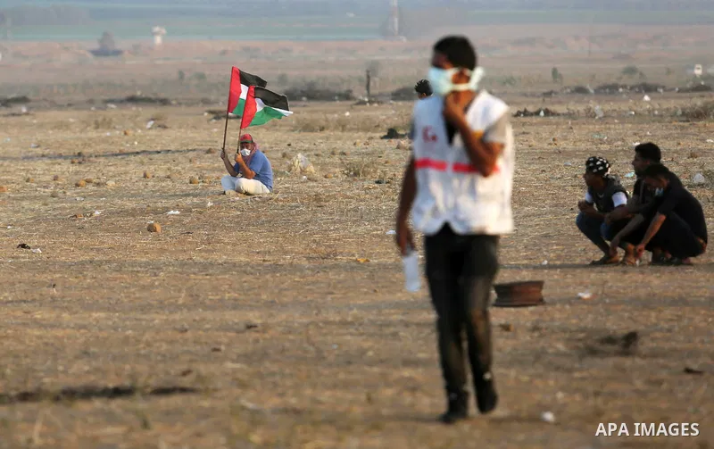 Palestinian protesters gather during clashes with Israeli troops in tents protest where Palestinian demand the right to return to their homeland at the Israel-Gaza border, in Khan Younis in the southern of Gaza Strip on...