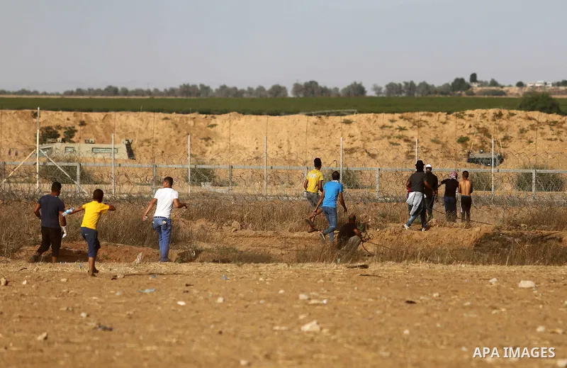 Palestinian protesters gather during clashes with Israeli troops in tents protest where Palestinian demand the right to return to their homeland at the Israel-Gaza border, in Khan Younis in the southern of Gaza Strip on...