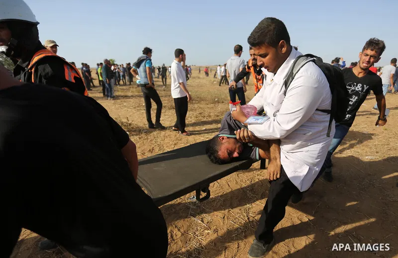 Palestinian protesters gather during clashes with Israeli troops in tents protest where Palestinian demand the right to return to their homeland at the Israel-Gaza border, in Khan Younis in the southern of Gaza Strip on...