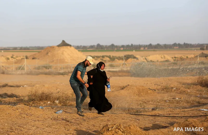 Palestinian protesters gather during clashes with Israeli troops in tents protest where Palestinian demand the right to return to their homeland at the Israel-Gaza border, in Khan Younis in the southern of Gaza Strip on...