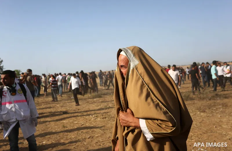 Palestinian protesters gather during clashes with Israeli troops in tents protest where Palestinian demand the right to return to their homeland at the Israel-Gaza border, in Khan Younis in the southern of Gaza Strip on...