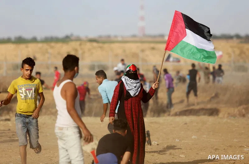 Palestinian protesters gather during clashes with Israeli troops in tents protest where Palestinian demand the right to return to their homeland at the Israel-Gaza border, in Khan Younis in the southern of Gaza Strip on...