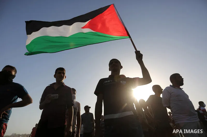 Palestinian protesters gather during clashes with Israeli troops in tents protest where Palestinian demand the right to return to their homeland at the Israel-Gaza border, in Khan Younis in the southern of Gaza Strip on...