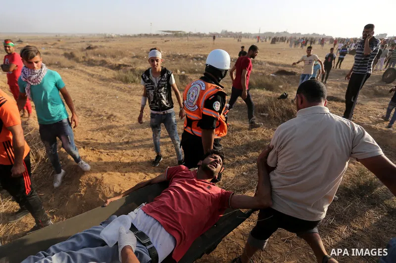 Palestinian protesters gather during clashes with Israeli troops in tents protest where Palestinian demand the right to return to their homeland at the Israel-Gaza border, in Khan Younis in the southern of Gaza Strip on...