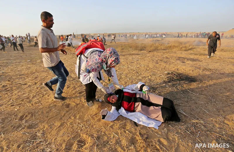 Palestinian protesters gather during clashes with Israeli troops in tents protest where Palestinian demand the right to return to their homeland at the Israel-Gaza border, in Khan Younis in the southern of Gaza Strip on...
