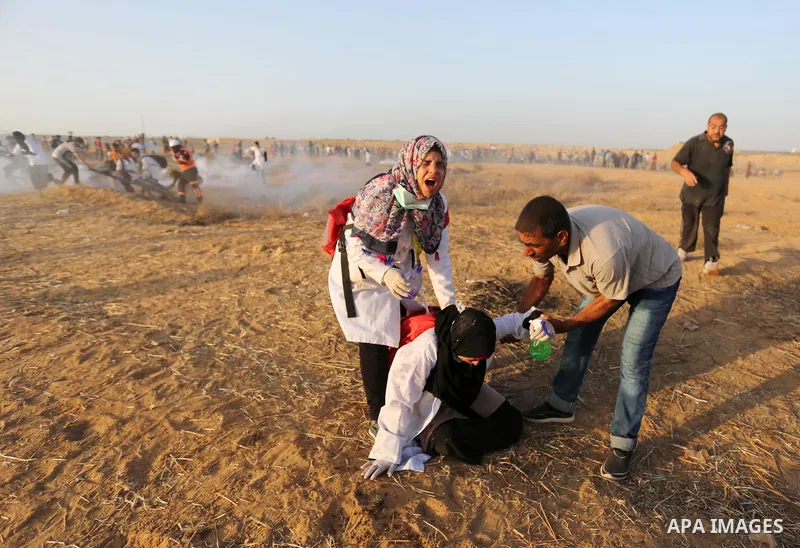 Palestinian protesters gather during clashes with Israeli troops in tents protest where Palestinian demand the right to return to their homeland at the Israel-Gaza border, in Khan Younis in the southern of Gaza Strip on...