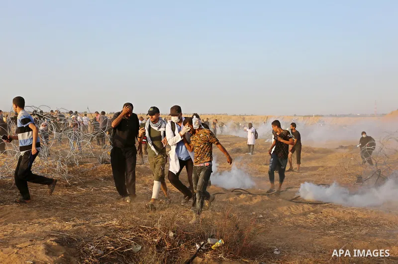 Palestinian protesters gather during clashes with Israeli troops in tents protest where Palestinian demand the right to return to their homeland at the Israel-Gaza border, in Khan Younis in the southern of Gaza Strip on...